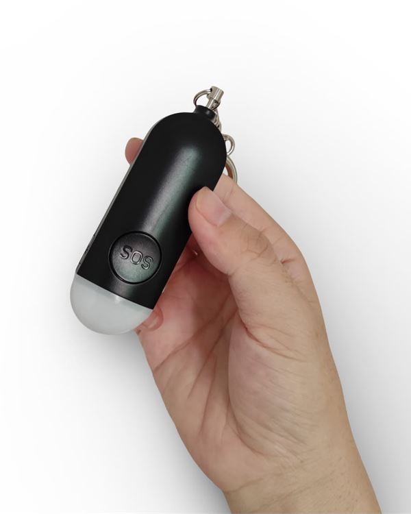 Onyx Black Hera alarm held between thumb and fingers