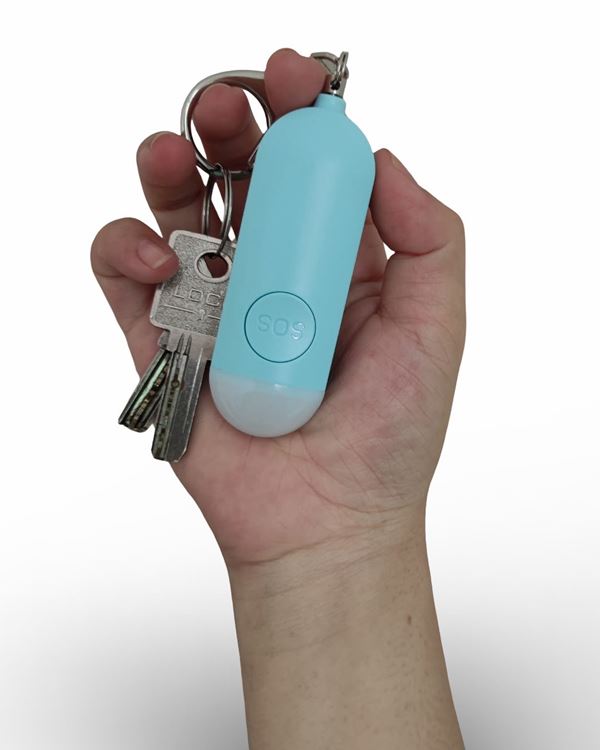 Baby Blue Hera alarm on a keyring with house keys, held in a hand